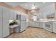 Bright kitchen with white cabinetry, appliances, and lots of natural light at 7309 Regina Royale Blvd # 21, Sarasota, FL 34238