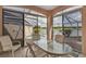 Lanai area with table and chairs with a beautiful view of the golf course and lake at 7309 Regina Royale Blvd # 21, Sarasota, FL 34238