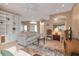 Cozy living room boasts a fireplace, built-in shelving, and open access to the rest of the home at 7309 Regina Royale Blvd # 21, Sarasota, FL 34238