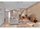 Open concept living room with TV, comfortable seating, and arched doorways providing seamless flow throughout at 7309 Regina Royale Blvd # 21, Sarasota, FL 34238
