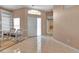 Bright living area with tiled floors, a high ceiling, and a glimpse of the bathroom at 7309 Regina Royale Blvd # 21, Sarasota, FL 34238