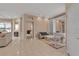 Spacious living area with tile flooring, neutral paint, and an open view to adjacent rooms at 7309 Regina Royale Blvd # 21, Sarasota, FL 34238