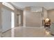 Bright and airy living area featuring tile flooring, high ceilings, and natural light at 7309 Regina Royale Blvd # 21, Sarasota, FL 34238