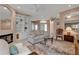 Bright living room featuring a fireplace, built-in shelving, and open access to the rest of the home at 7309 Regina Royale Blvd # 21, Sarasota, FL 34238
