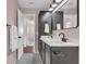Stylish bathroom with chic black vanity, white countertops, and black and white mosaic tile flooring at 807 Harbor Ave, Ellenton, FL 34222