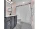Charming bathroom boasts modern fixtures, stylish black vanity, and elegant black and white tiled flooring at 807 Harbor Ave, Ellenton, FL 34222