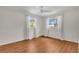 Bright bedroom features neutral walls, wood-look floors, and dual windows for plenty of natural light at 807 Harbor Ave, Ellenton, FL 34222