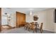 Traditional dining room with wood paneling, modern chandelier, and seating for six at 807 Harbor Ave, Ellenton, FL 34222