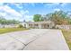 Charming home with a spacious driveway, carport, and well-maintained lawn at 807 Harbor Ave, Ellenton, FL 34222