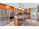 Contemporary kitchen with stainless steel appliances, a center island, and modern lighting at 807 Harbor Ave, Ellenton, FL 34222