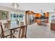 Open concept kitchen and dining area with backyard views and stainless steel appliances at 807 Harbor Ave, Ellenton, FL 34222