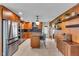 Modern kitchen with stainless steel appliances, a center island, and stylish backsplash at 807 Harbor Ave, Ellenton, FL 34222