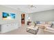 Well-lit living room features a comfortable sectional sofa and a glimpse into the adjacent kitchen at 807 Harbor Ave, Ellenton, FL 34222