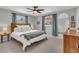 Comfortable bedroom with ceiling fan, windows, and neutral decor at 807 Harbor Ave, Ellenton, FL 34222
