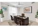 Well-lit home office with a large desk, comfortable chairs, and elegant decor at 807 Harbor Ave, Ellenton, FL 34222