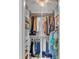 Well-organized walk-in closet offers ample storage with built-in shelves and rods, plus a decorative light at 807 Harbor Ave, Ellenton, FL 34222