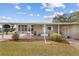Inviting exterior view featuring covered entry and landscaped front yard, offering a welcoming curb appeal at 8517 Buckingham Pl, Palmetto, FL 34221