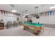 Game room with a pool table and sports memorabilia, perfect for leisure and entertainment at 8517 Buckingham Pl, Palmetto, FL 34221