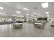 Spacious community hall with tables, chairs, stage, and ample seating, ideal for events and gatherings at 8517 Buckingham Pl, Palmetto, FL 34221