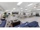 Large community hall with a stage, tables, chairs, and comfortable seating area for gatherings and events at 8517 Buckingham Pl, Palmetto, FL 34221