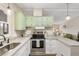 Stylish kitchen with granite countertops, stainless steel appliances, and plenty of counter space, great for entertaining at 8517 Buckingham Pl, Palmetto, FL 34221