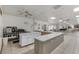 The community kitchen area features ample counter space and equipment, perfect for food service for the hall at 8517 Buckingham Pl, Palmetto, FL 34221
