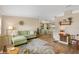 Charming living room leading to a well-lit kitchen and dining area, creating an open and airy atmosphere at 8517 Buckingham Pl, Palmetto, FL 34221