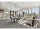 Bright sunroom with expansive windows, neutral carpet, and a dining table with comfortable seating for four at 8517 Buckingham Pl, Palmetto, FL 34221