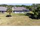 Stunning aerial view of the home, showcasing the expansive yard and screened pool area at 8615 59Th E St, Parrish, FL 34219