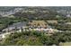 Expansive aerial view of a home with lush landscaping and a pond nearby at 8615 59Th E St, Parrish, FL 34219