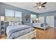 Spacious bedroom features two beds, ceiling fan, and ample natural light creating a comfortable retreat at 8615 59Th E St, Parrish, FL 34219