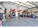 Spacious garage with ample storage, including overhead racks, shelving, and bike hooks, perfect for organization at 8615 59Th E St, Parrish, FL 34219