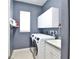 Functional laundry room with washer, dryer, sink, and ample cabinet storage at 8615 59Th E St, Parrish, FL 34219