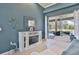 Cozy living room with fireplace and sliding doors to the pool area, creating an inviting indoor-outdoor space at 8615 59Th E St, Parrish, FL 34219
