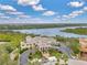 Beautiful waterfront clubhouse with a marina, lush landscaping, and ample parking, offering stunning river views at 9818 Portside Ter, Bradenton, FL 34212