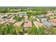 Aerial view of home and surrounding neighborhood with nearby lake and golf course at 9818 Portside Ter, Bradenton, FL 34212