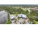 Aerial view of a community with a golf course, lake, and clubhouse, offering a luxurious and active lifestyle at 9818 Portside Ter, Bradenton, FL 34212