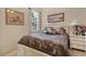 Cozy bedroom features comfortable bed with soft linens, a nightstand, and tranquil decor at 9818 Portside Ter, Bradenton, FL 34212