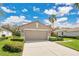 Charming single-Gathering home with a well-maintained lawn, mature landscaping, and a spacious driveway at 9818 Portside Ter, Bradenton, FL 34212