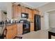 Spacious kitchen featuring stainless steel appliances, tile flooring and wood cabinets at 9818 Portside Ter, Bradenton, FL 34212