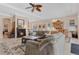 Inviting open-concept living space with a fireplace, comfortable seating, and dining area at 9818 Portside Ter, Bradenton, FL 34212
