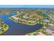 Community aerial view showcasing waterfront homes, lush landscapes, and serene lakeside living at 16436 Daysailor Trl, Lakewood Ranch, FL 34202