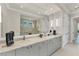 Bright bathroom with marble countertop, dual sinks, and a shower, creating a luxurious and functional space at 16436 Daysailor Trl, Lakewood Ranch, FL 34202