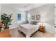 Well-lit bedroom with hardwood floors, a ceiling fan, one window and decorative accents at 16436 Daysailor Trl, Lakewood Ranch, FL 34202