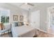 Bright bedroom with hardwood floors, a ceiling fan, one window and decorative accents at 16436 Daysailor Trl, Lakewood Ranch, FL 34202