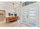 Open-concept dining room features high ceilings, modern lighting, and a large window at 16436 Daysailor Trl, Lakewood Ranch, FL 34202