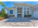 Gorgeous light blue house with detailed window features and front door entry at 16436 Daysailor Trl, Lakewood Ranch, FL 34202