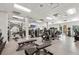 Well-equipped gym featuring modern exercise machines, weights, and mirrored walls for a complete workout experience at 16436 Daysailor Trl, Lakewood Ranch, FL 34202
