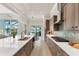 Gourmet kitchen with stainless appliances, ample counter space, and a view of the outdoor pool area at 16436 Daysailor Trl, Lakewood Ranch, FL 34202