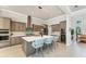 Spacious kitchen with a center island, quartz countertops, stainless steel appliances, and a wine fridge at 16436 Daysailor Trl, Lakewood Ranch, FL 34202